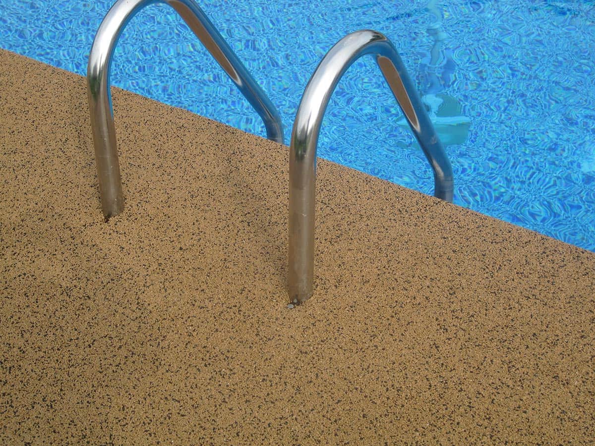 Moisture mitigating epoxy on a pool deck
